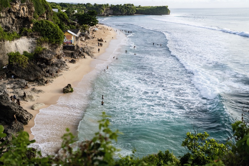 Cliff beach aerial view with turquoise waves