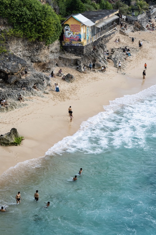 Beach aerial with people in turquoise surf