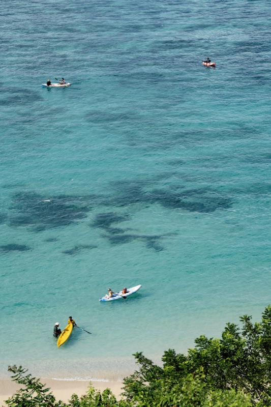 Crystal clear turquoise water with kayakers from above